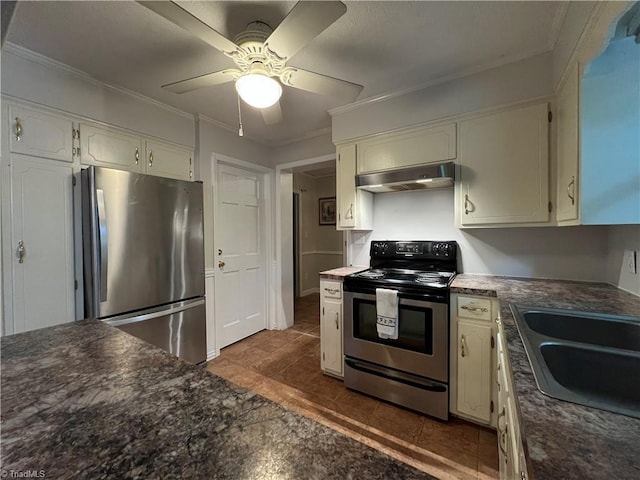 kitchen featuring a ceiling fan, dark countertops, under cabinet range hood, ornamental molding, and stainless steel appliances