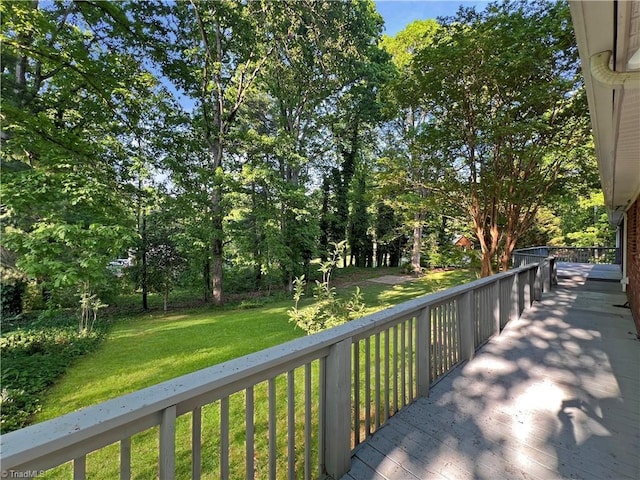 wooden terrace with a yard