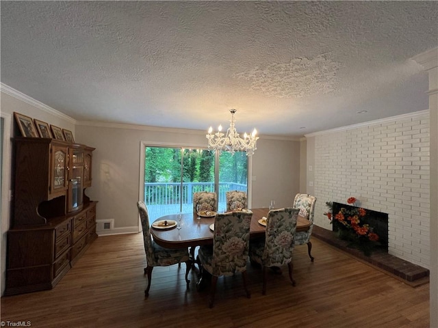 dining area featuring a textured ceiling, wood finished floors, and a notable chandelier