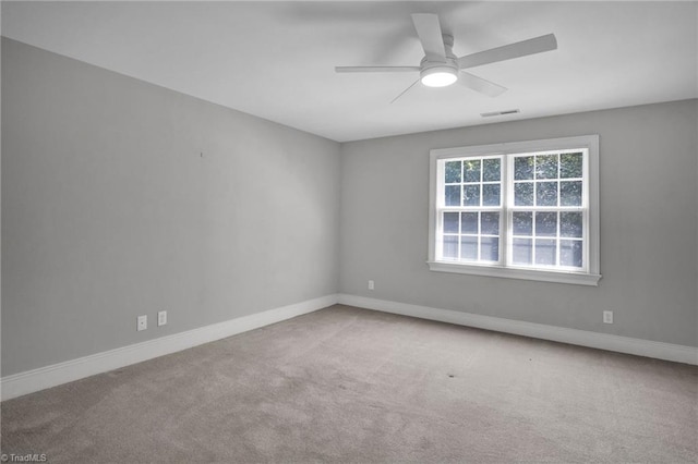 empty room with light carpet and ceiling fan