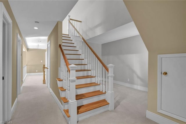 stairs featuring carpet floors