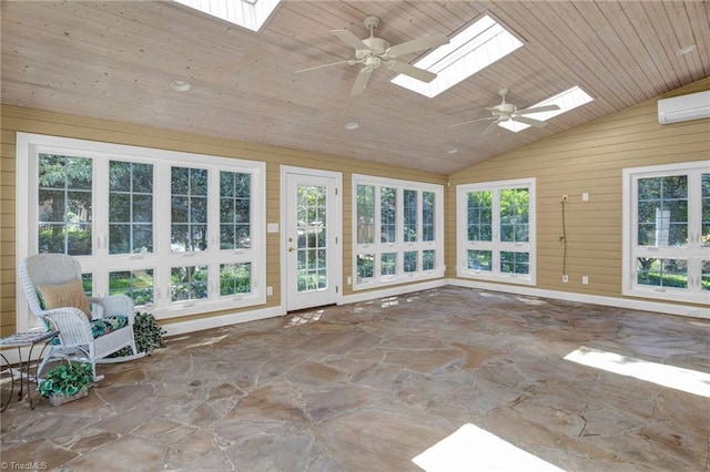 unfurnished sunroom with ceiling fan, plenty of natural light, and lofted ceiling with skylight