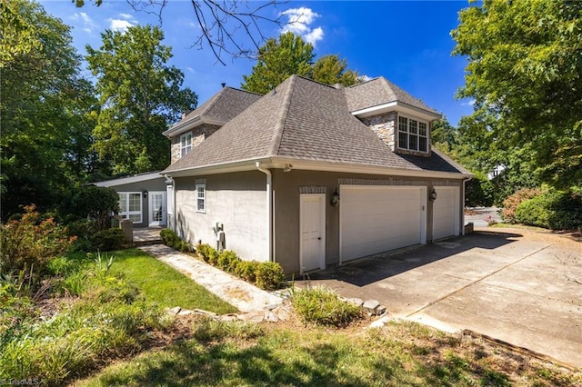 view of property exterior with a garage