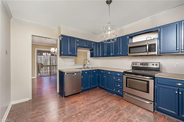 kitchen with blue cabinets, an inviting chandelier, ornamental molding, appliances with stainless steel finishes, and dark hardwood / wood-style floors