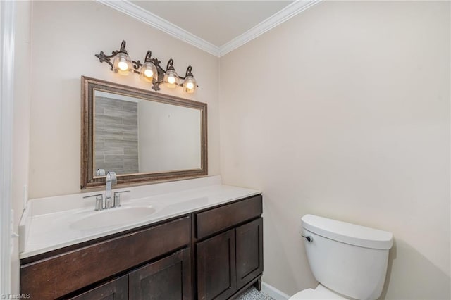 bathroom with ornamental molding, toilet, and vanity