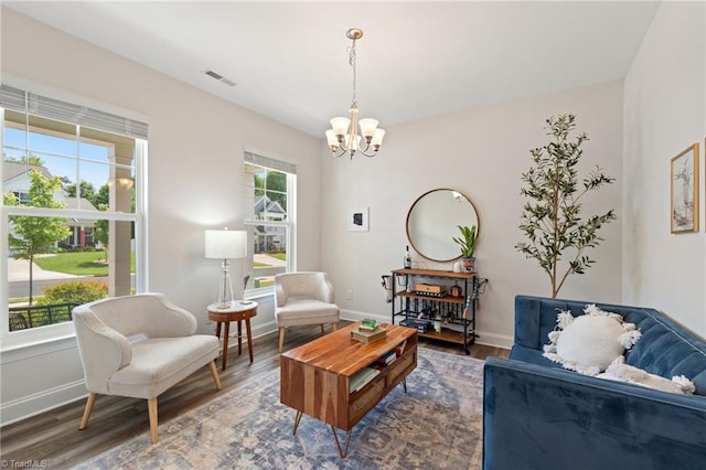 4077 Glenn Knoll Ln, Winston-Salem, NC 27107 - living area featuring a chandelier, wood finished floors, and baseboards