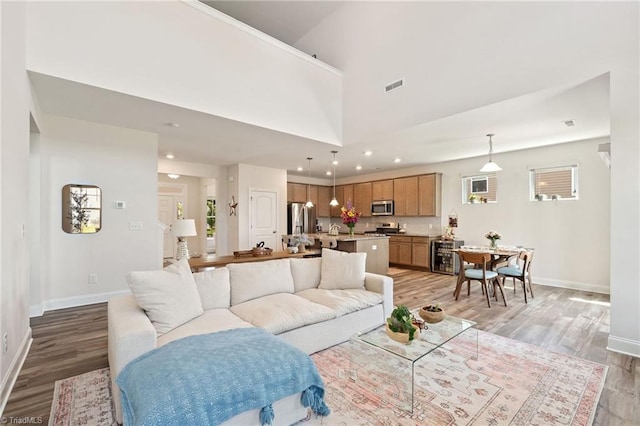 4077 Glenn Knoll Ln, Winston-Salem, NC 27107 - living room with light wood-style floors, baseboards, recessed lighting, and healthy amount of natural light