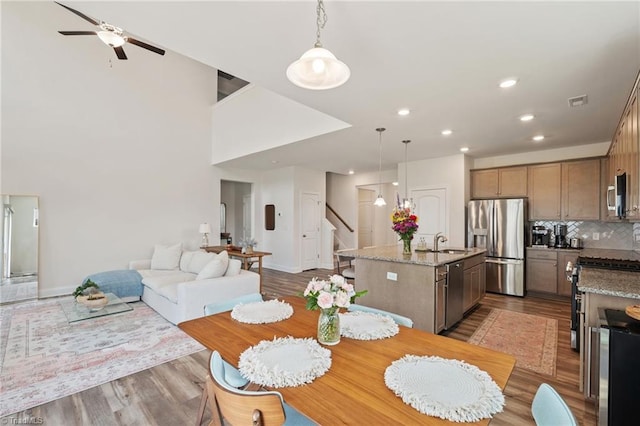 4077 Glenn Knoll Ln, Winston-Salem, NC 27107 - dining space featuring stairway, wood finished floors, a ceiling fan, recessed lighting, and baseboards