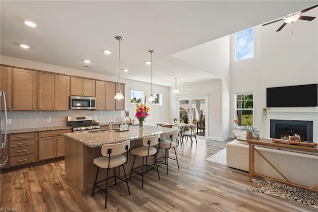 4077 Glenn Knoll Ln, Winston-Salem, NC 27107 - kitchen with stainless steel appliances, healthy amount of natural light, light stone countertops, and recessed lighting