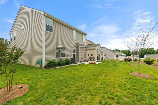 4077 Glenn Knoll Ln, Winston-Salem, NC 27107 - rear view of property with a patio, central AC, a lawn, and a garage