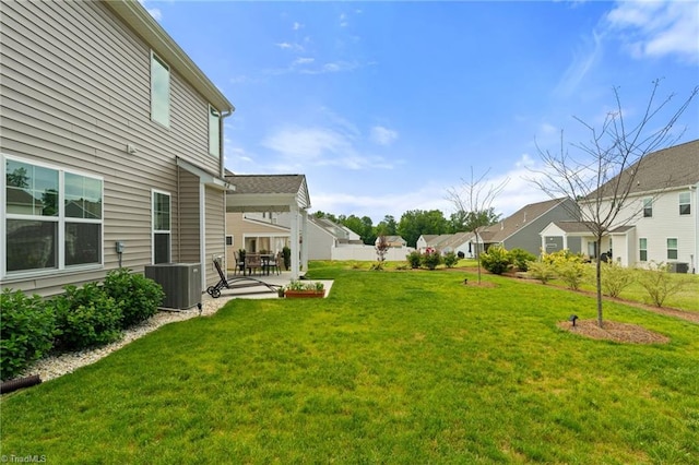 4077 Glenn Knoll Ln, Winston-Salem, NC 27107 - view of grassy yard with central AC, a patio area, and a residential view