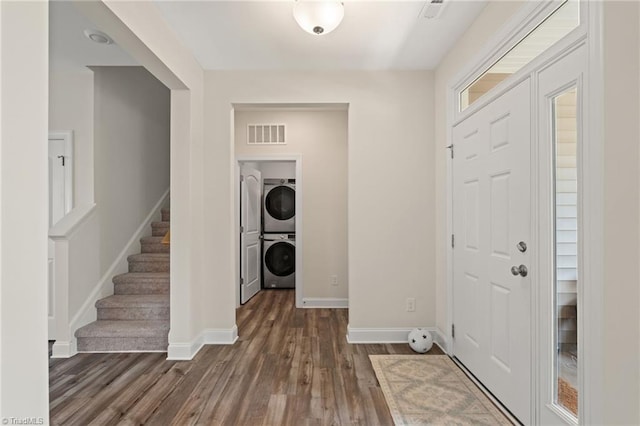4077 Glenn Knoll Ln, Winston-Salem, NC 27107 - entrance foyer with stacked washer / dryer, dark wood-style floors, baseboards, and stairway