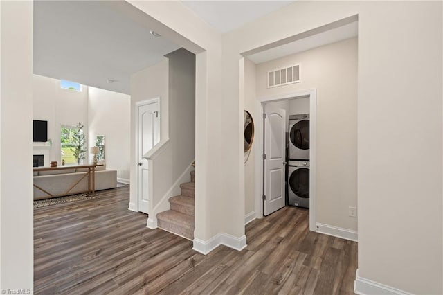 4077 Glenn Knoll Ln, Winston-Salem, NC 27107 - laundry room featuring stacked washer / dryer, wood finished floors, baseboards, and a fireplace
