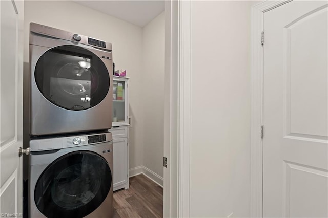 4077 Glenn Knoll Ln, Winston-Salem, NC 27107 - laundry room with stacked washer / drying machine, wood finished floors, cabinet space, and baseboards