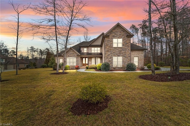 view of front of home with a yard