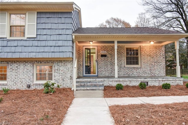 view of exterior entry with covered porch