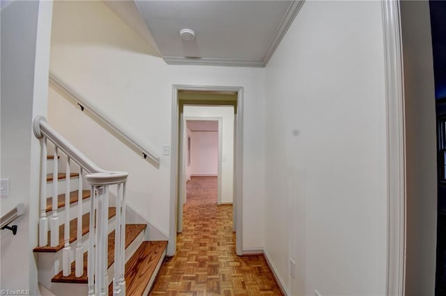 hallway featuring light parquet flooring and ornamental molding