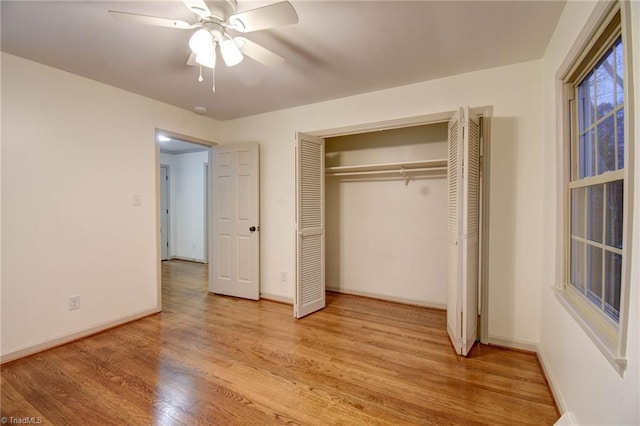 unfurnished bedroom with a closet, ceiling fan, and light hardwood / wood-style flooring