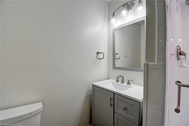 bathroom with vanity and toilet