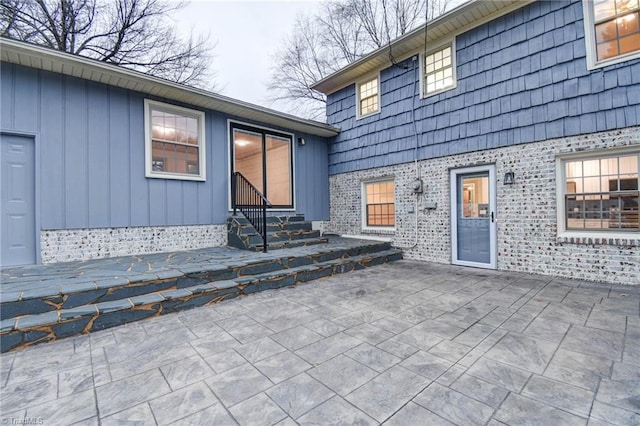 entrance to property with a patio area