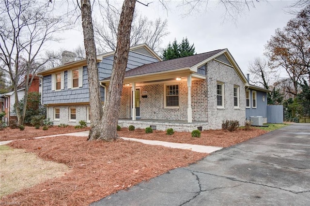 split level home featuring central air condition unit and a porch