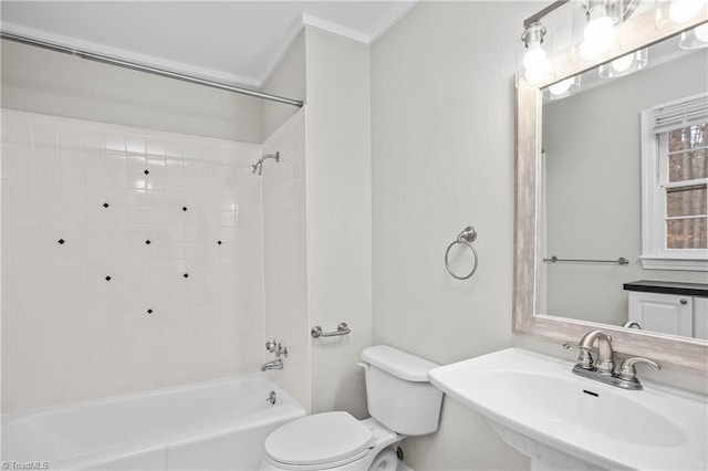 bathroom with shower / bathtub combination, a sink, and toilet