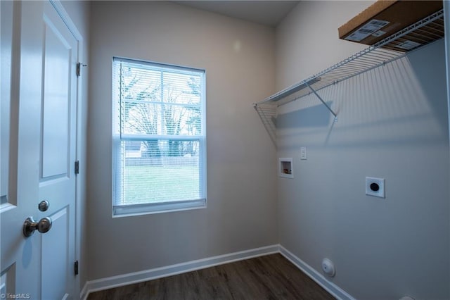 laundry area with hookup for a washing machine, hookup for an electric dryer, laundry area, dark wood-style flooring, and baseboards