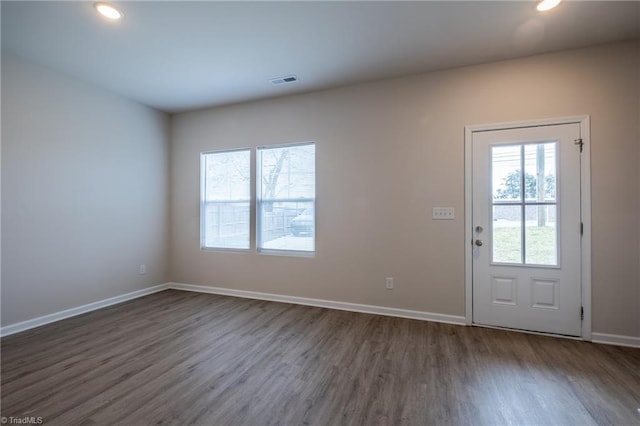 entrance foyer with dark wood-type flooring, recessed lighting, visible vents, and baseboards