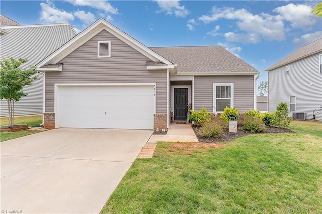 5838 Springer Dr, Greensboro, NC 27405 - view of front of house with an attached garage, central AC, concrete driveway, brick siding, and a front yard