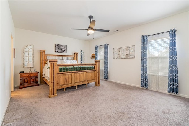 5838 Springer Dr, Greensboro, NC 27405 - bedroom with multiple windows, light colored carpet, and baseboards