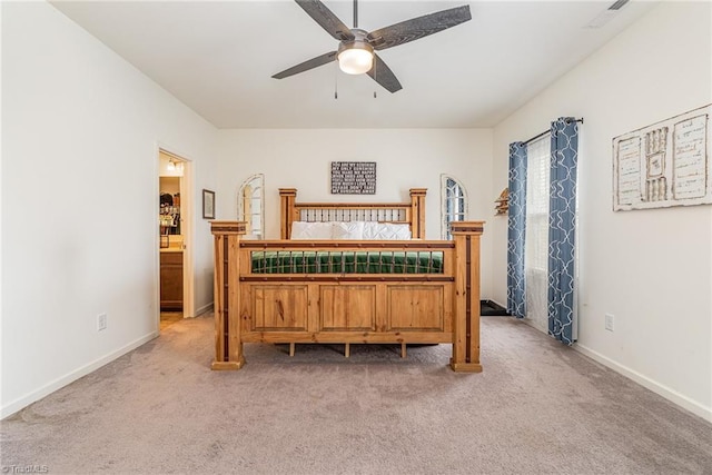 5838 Springer Dr, Greensboro, NC 27405 - bedroom featuring light carpet, baseboards, and a ceiling fan