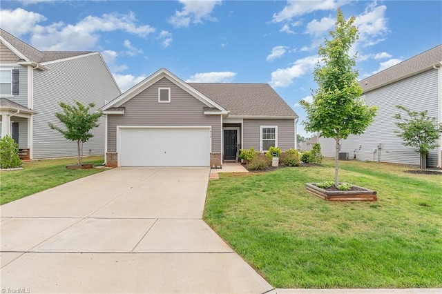 5838 Springer Dr, Greensboro, NC 27405 - view of front of house with a garage, concrete driveway, a front yard, and brick siding