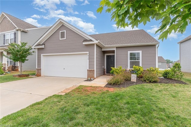 5838 Springer Dr, Greensboro, NC 27405 - view of front of house featuring concrete driveway, a front yard, an attached garage, brick siding, and a shingled roof