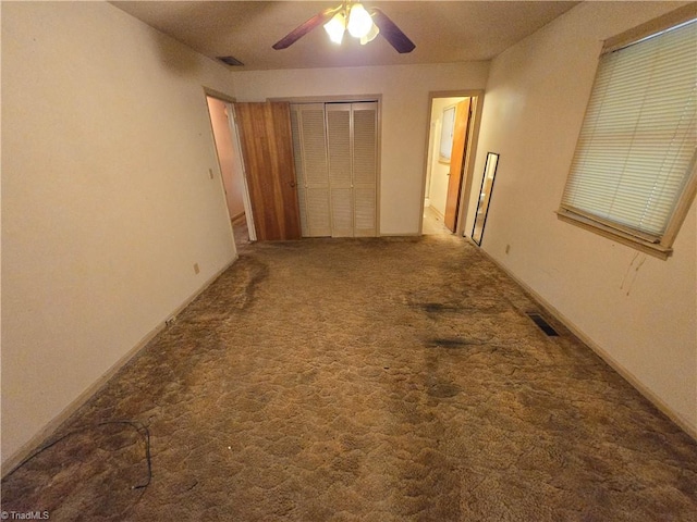 hallway with a textured ceiling and carpet