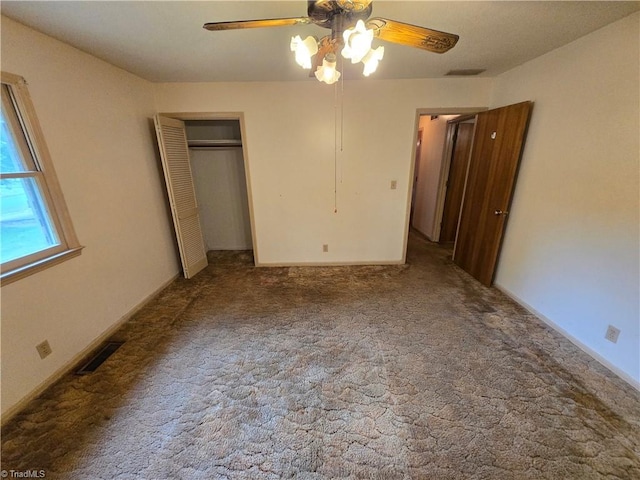 unfurnished bedroom featuring a closet, ceiling fan, and carpet floors