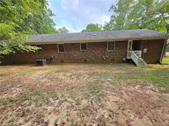 rear view of house with cooling unit