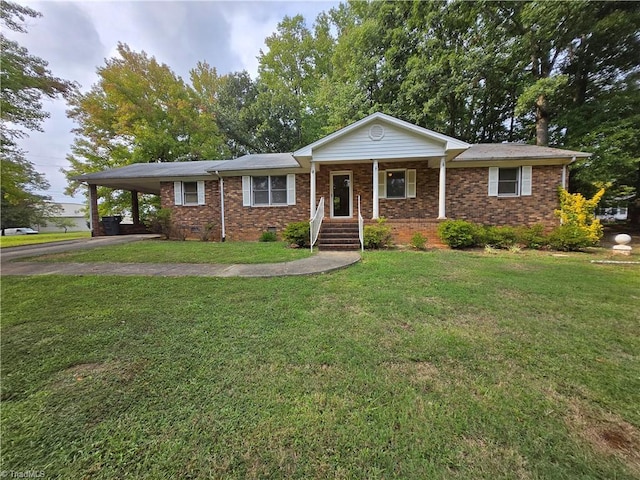 ranch-style house with a porch and a front yard