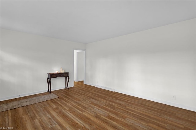 unfurnished living room with hardwood / wood-style flooring