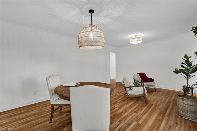 dining area with hardwood / wood-style flooring