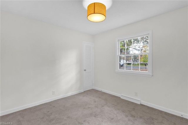 spare room with light carpet