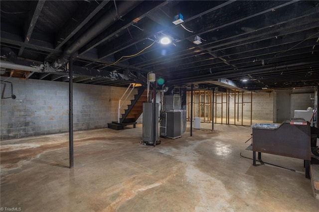 basement with water heater and heating unit