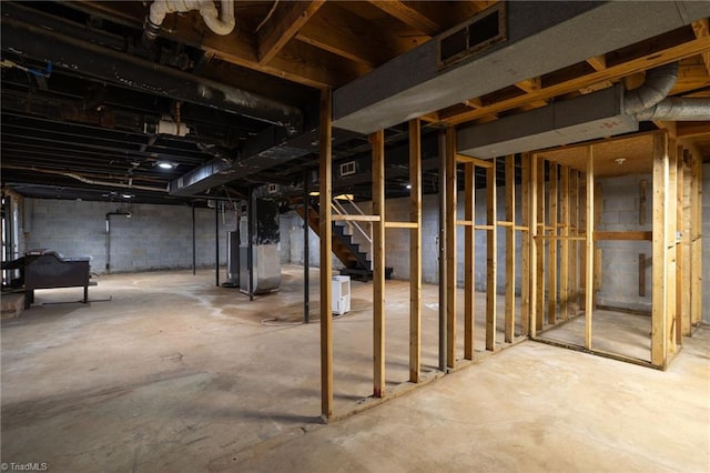 basement featuring heating unit