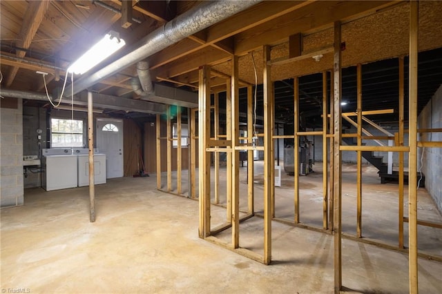 basement with washer and clothes dryer