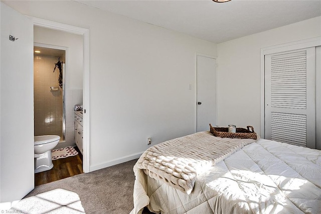 carpeted bedroom with connected bathroom and a closet