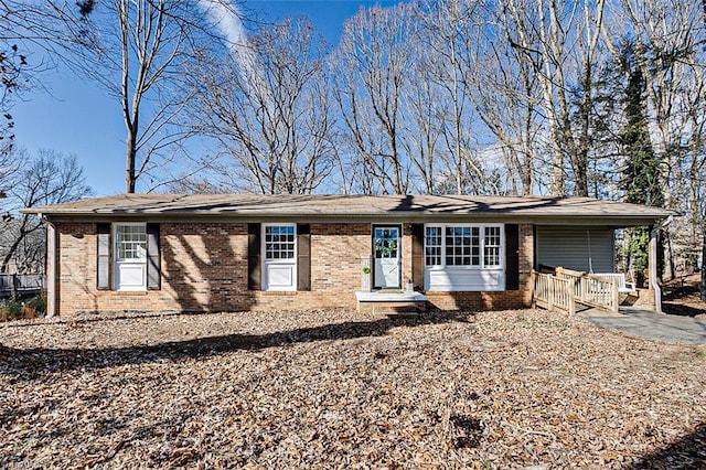 ranch-style house with a carport