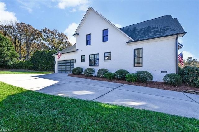 exterior space with a garage and a front yard