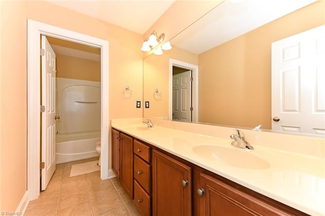 full bathroom with toilet, vanity, tile patterned floors, and tub / shower combination