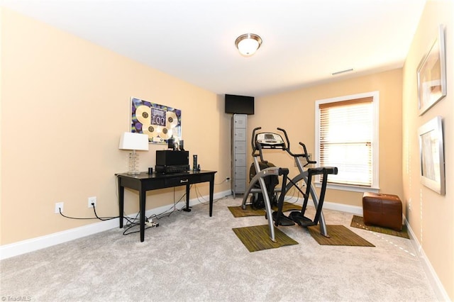 exercise room with light carpet