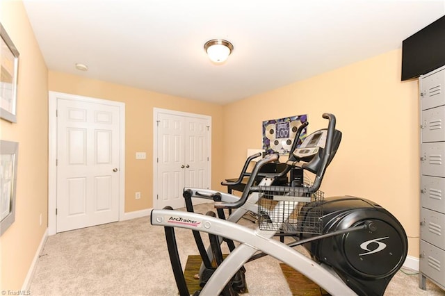 workout area featuring light carpet