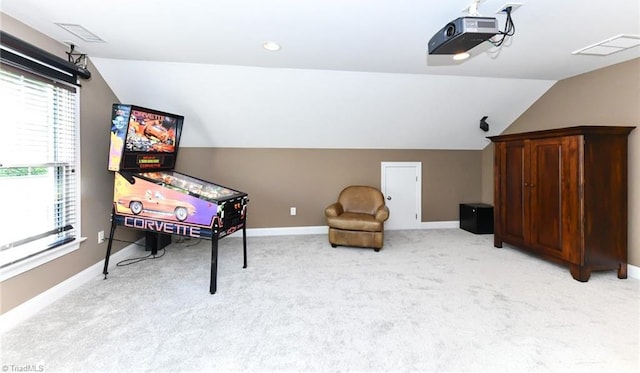 playroom with light colored carpet and vaulted ceiling